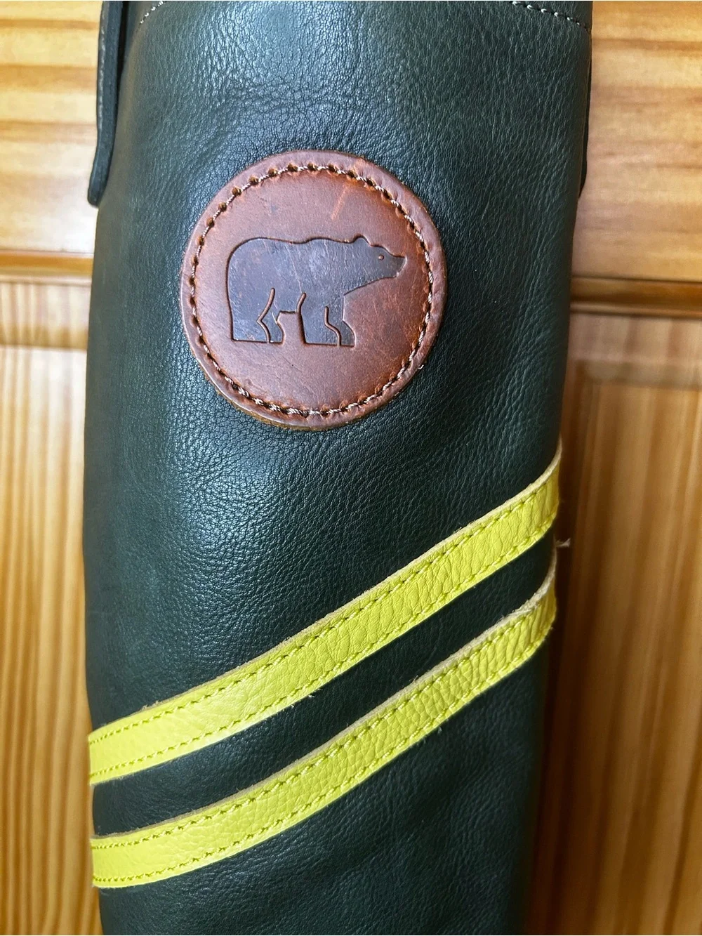 Green Leather Bottle Carrier with Yellow Stripes and Bear Patch